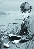 Photo of Victorian woman reading a book and holding a mallet